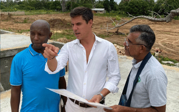 Sales Executive Maka Shembwana, Architect Armando Ernesto Passuello and Building Executive Mohamed Osman at Jamiitown site.